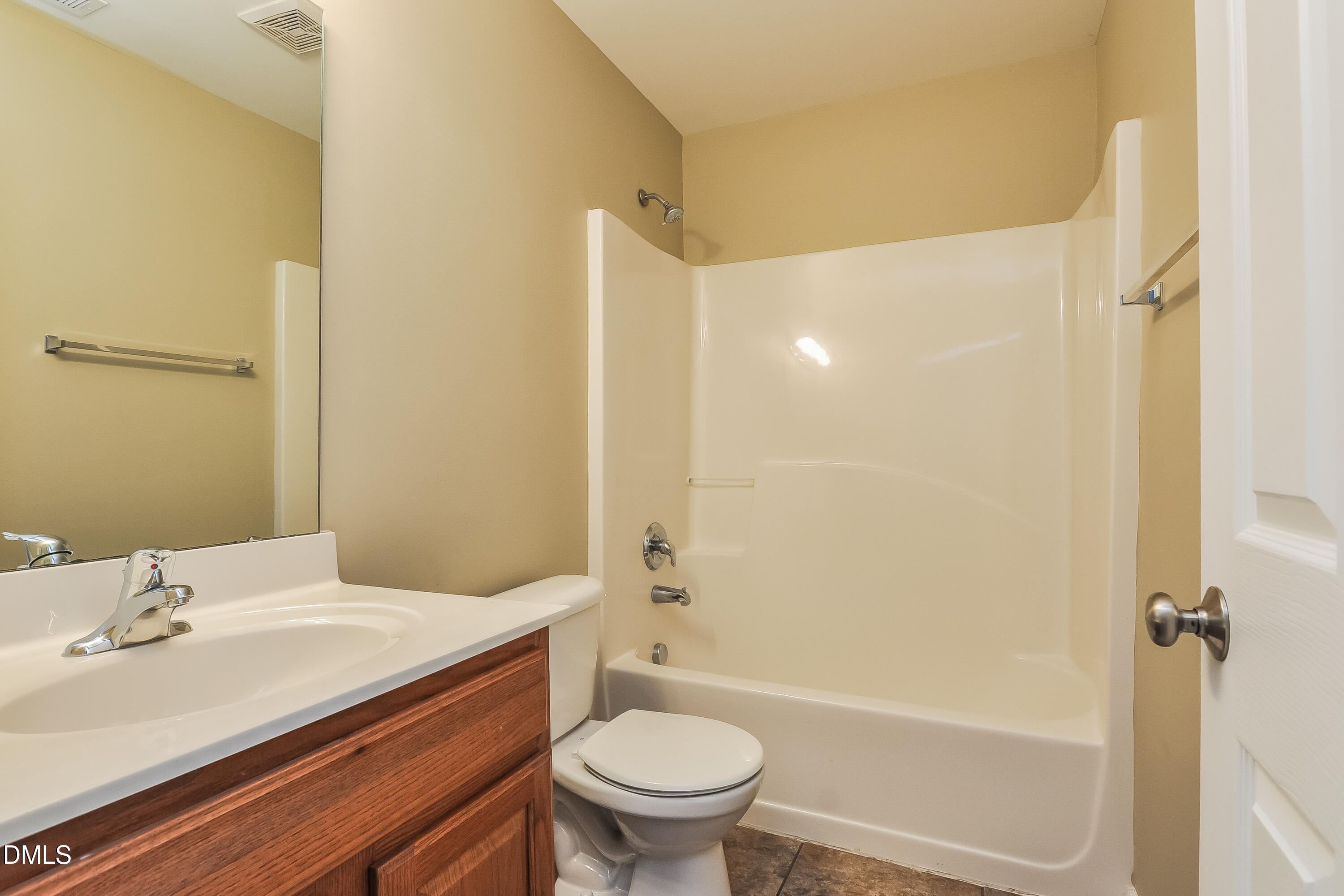 88 Meadow Loop Drive Clayton, NC 27527 - Photo 13 of 15 a bathroom with a sink a toilet and shower
