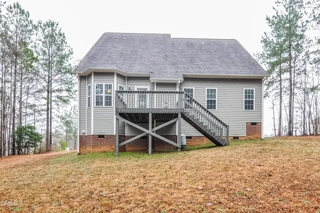 a front view of a house with wooden stairs