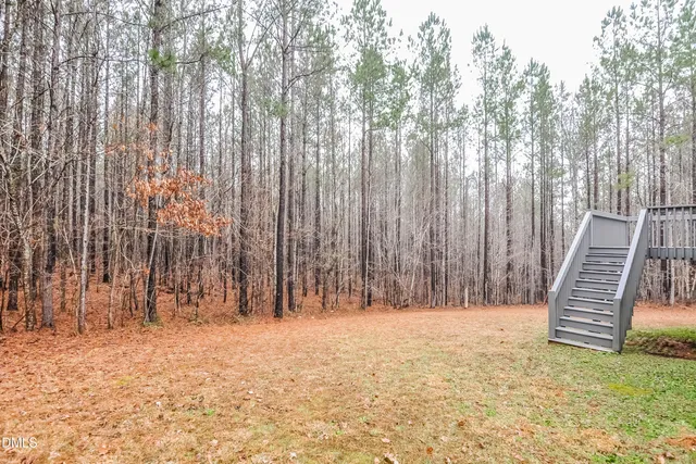 a view of outdoor space with wooden fence
