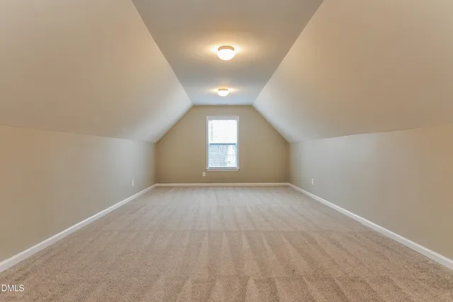 an empty room with a empty space and windows