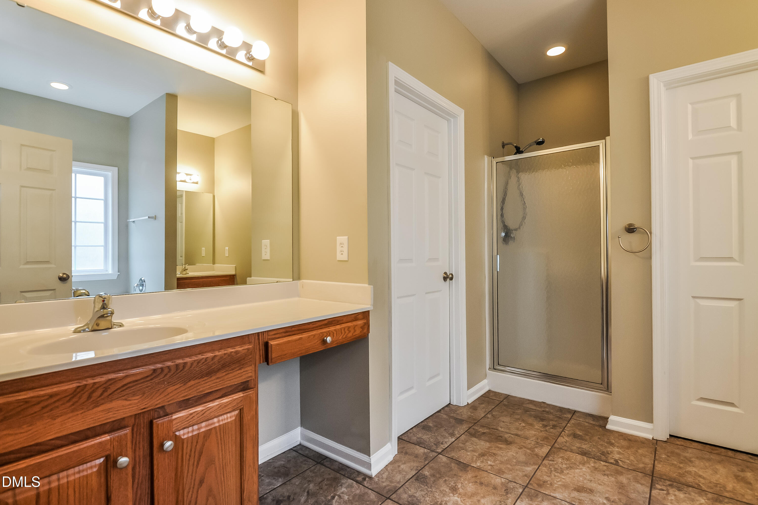 88 Meadow Loop Drive Clayton, NC 27527 - Photo 10 of 15 a bathroom with a sink and a mirror