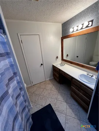 a room with pool table and mirror