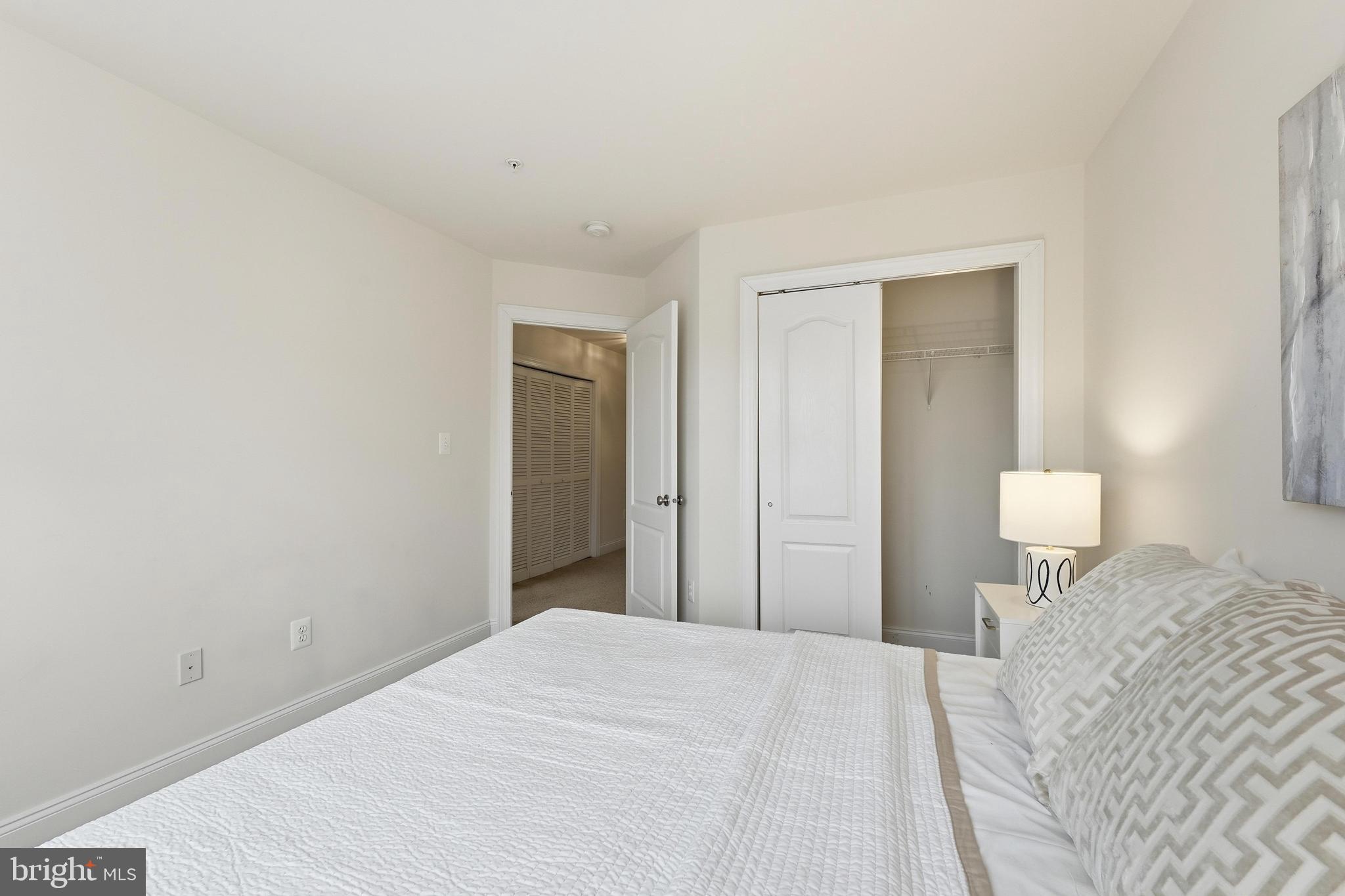 2284 Brimstone Place Hanover, MD 21076 - Photo 19 of 37 a bedroom with a bed and a night lamp