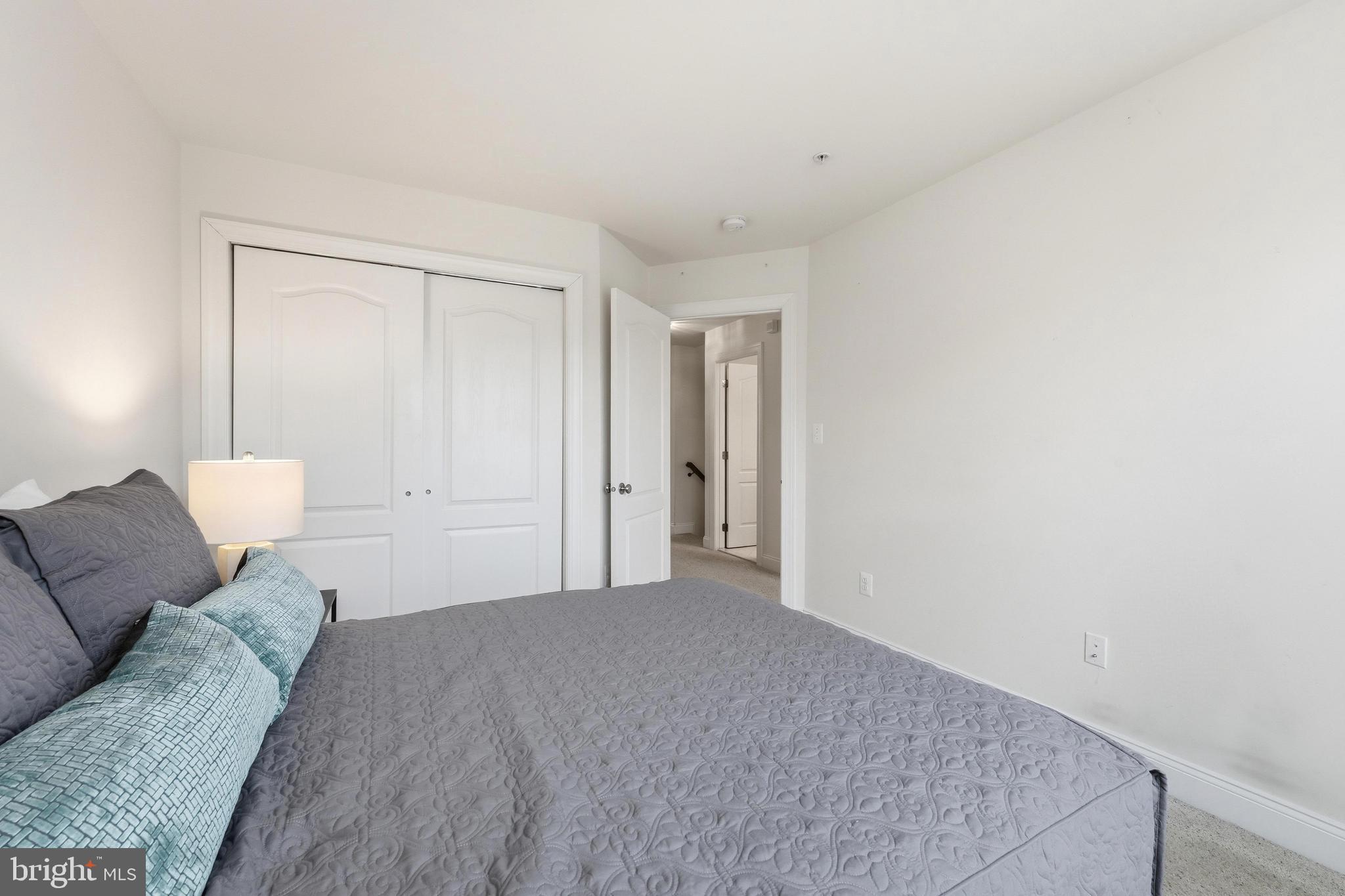 2284 Brimstone Place Hanover, MD 21076 - Photo 21 of 37 a view of a bedroom with furniture and wooden floor