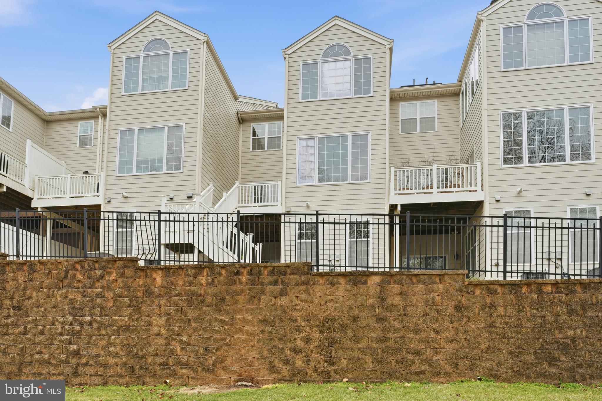 2284 Brimstone Place Hanover, MD 21076 - Photo 35 of 37 a large building with a outdoor space