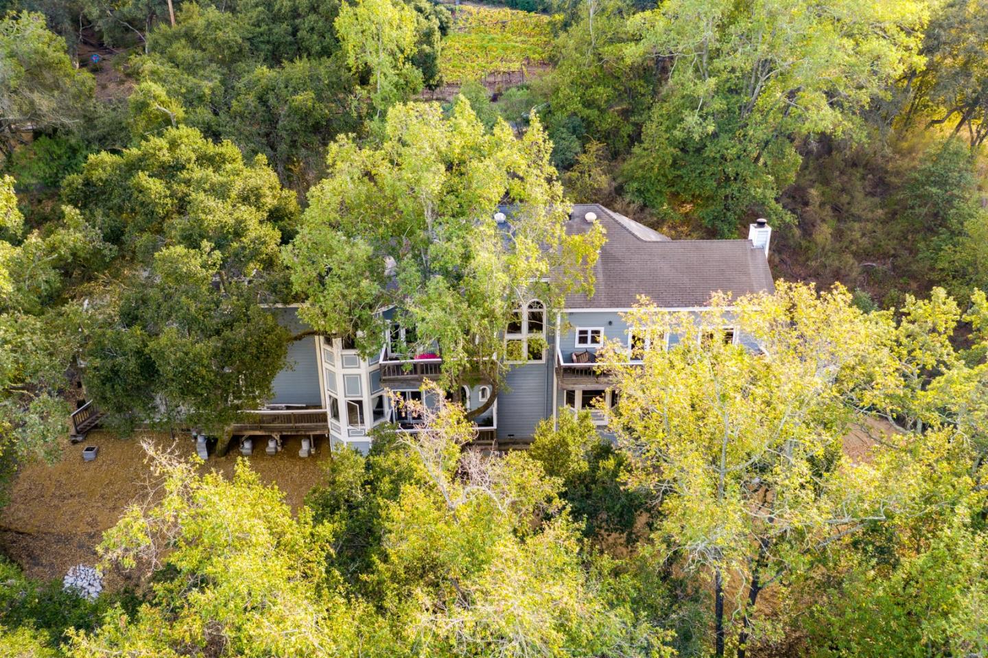 a view of a house with a yard and sitting area