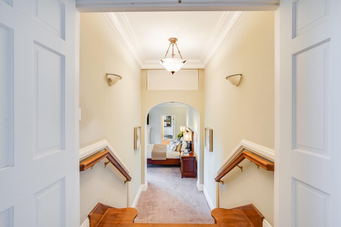 18565 Overlook Road Monte Sereno, CA 95030 - Photo 27 of 72 a view of a livingroom with a fireplace a chandelier and entryway
