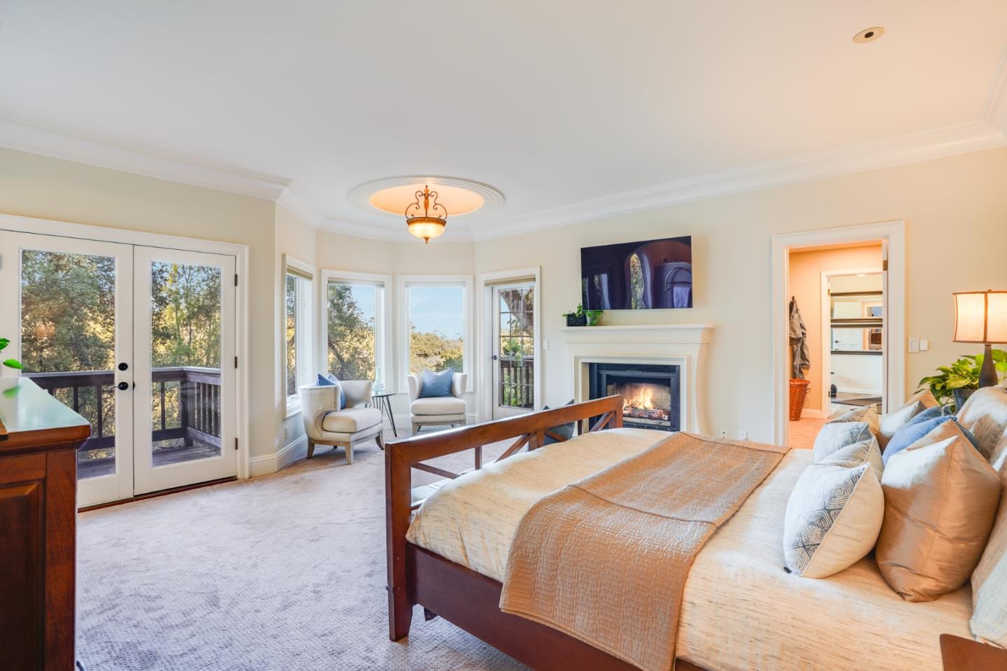 18565 Overlook Road Monte Sereno, CA 95030 - Photo 29 of 72 a bedroom with a bed couch and a large window