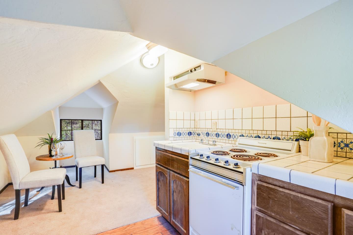 18565 Overlook Road Monte Sereno, CA 95030 - Photo 52 of 72 a kitchen that has a stove and a table