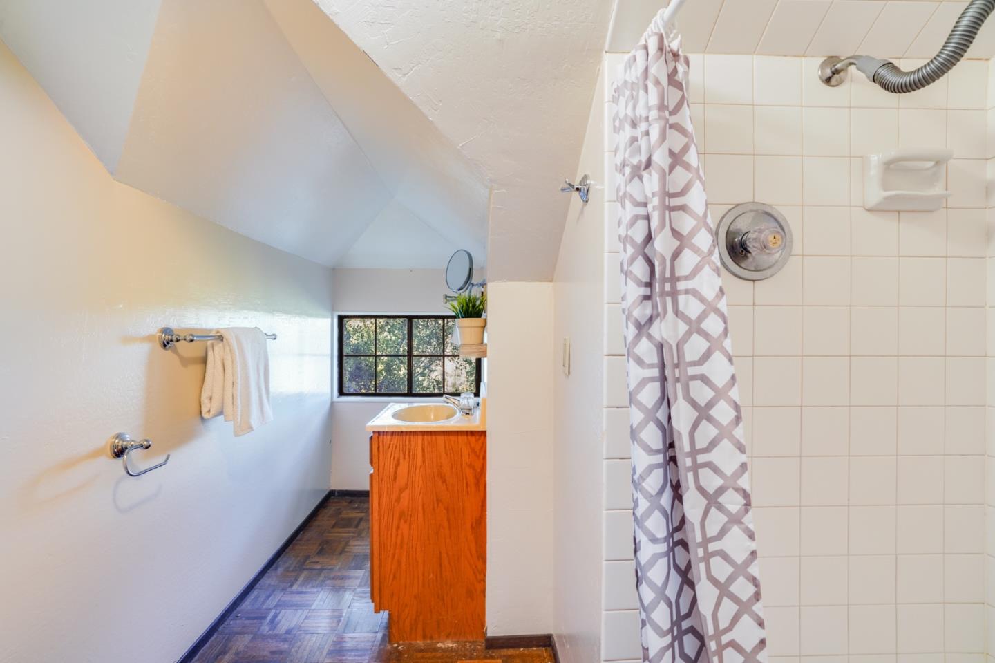 18565 Overlook Road Monte Sereno, CA 95030 - Photo 57 of 72 a bathroom with a shower curtain and a window