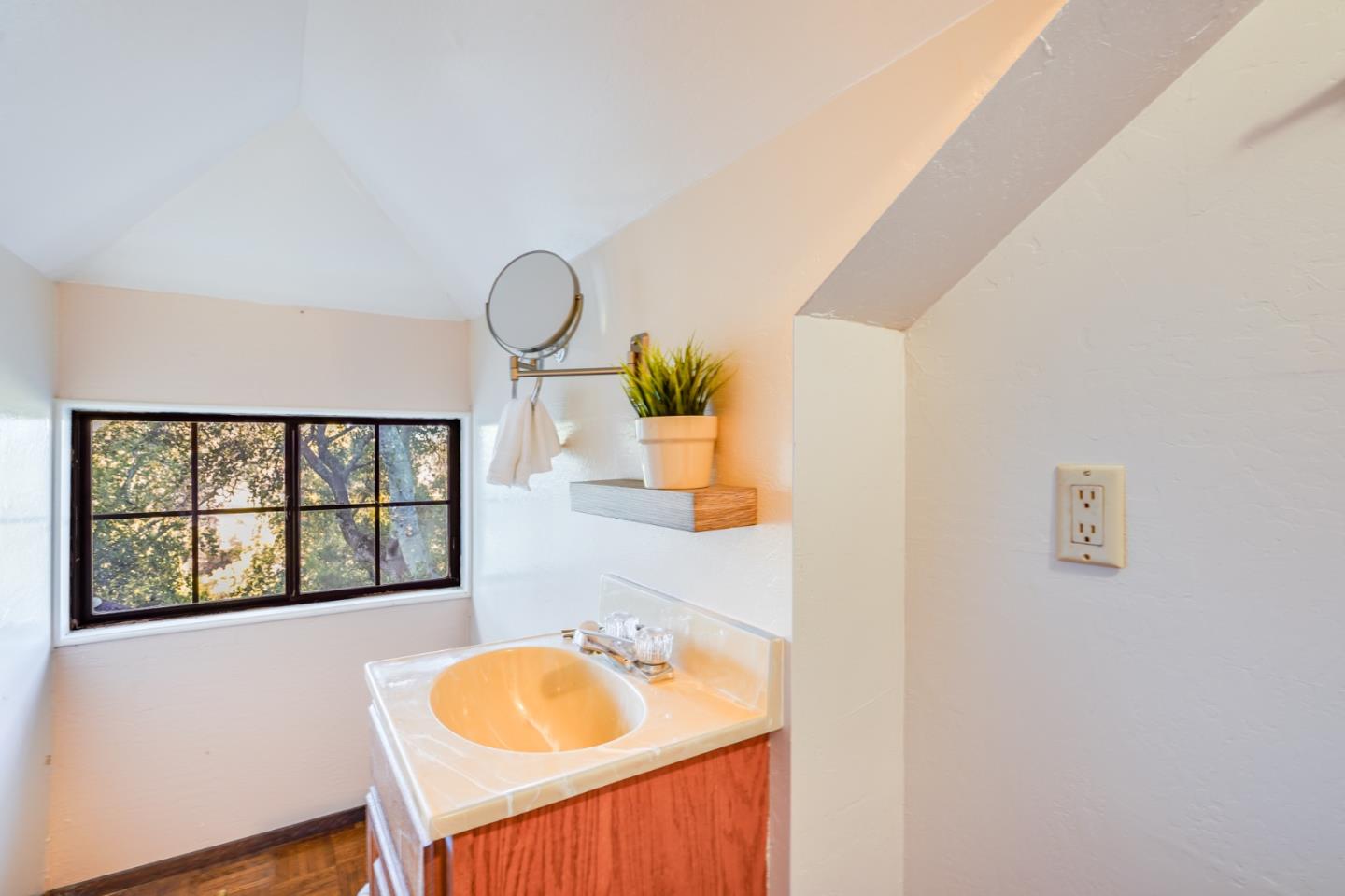 18565 Overlook Road Monte Sereno, CA 95030 - Photo 58 of 72 a bathroom with a granite countertop sink and a window