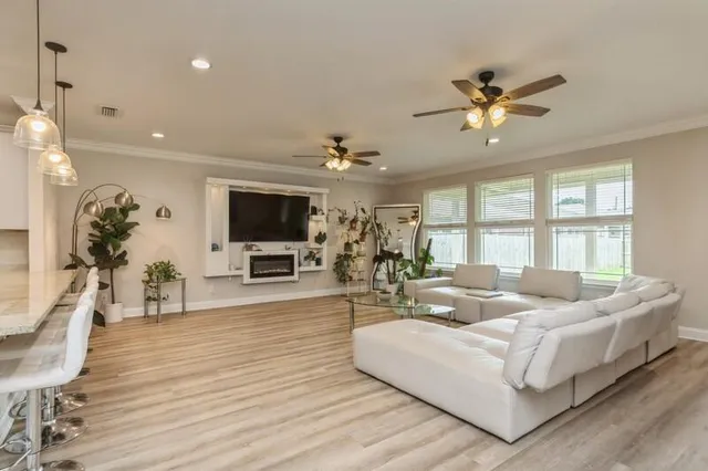 a living room with furniture and a flat screen tv
