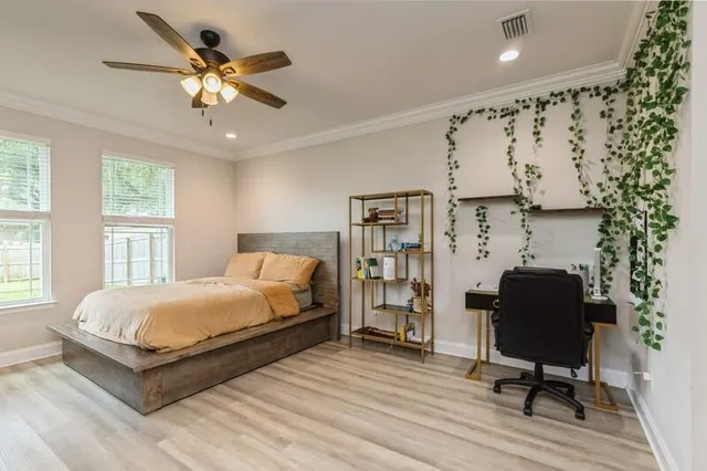 a bedroom with a bed and a chair