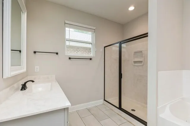 a bathroom with a sink and a large mirror