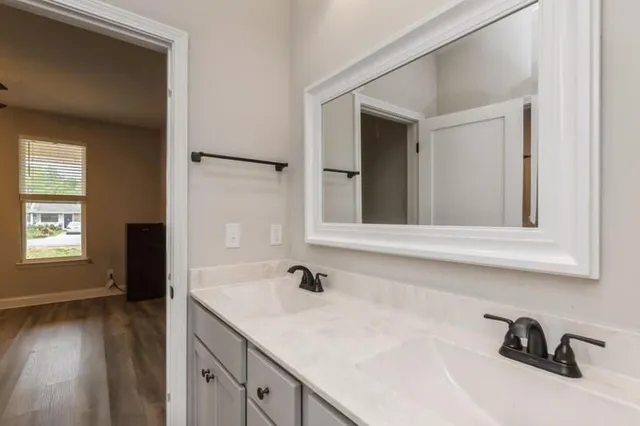 a bathroom with a sink and a mirror
