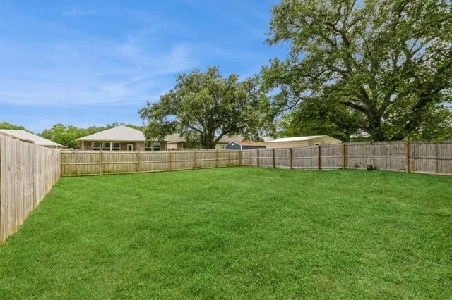 a view of a backyard with a garden
