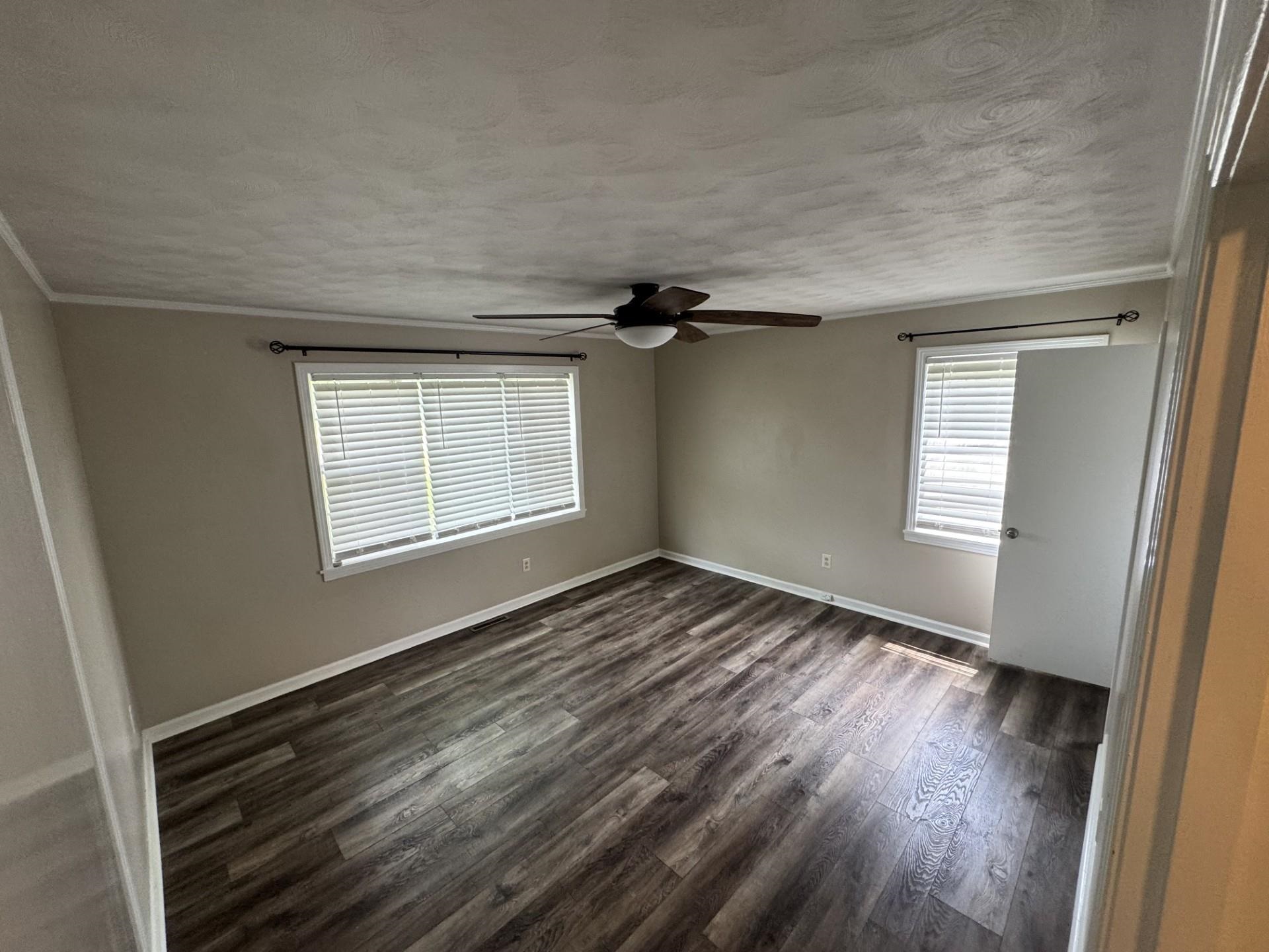 2631 Highway 51 Ripley, TN 38063 - Photo 14 of 17 a view of an empty room with wooden floor and a window