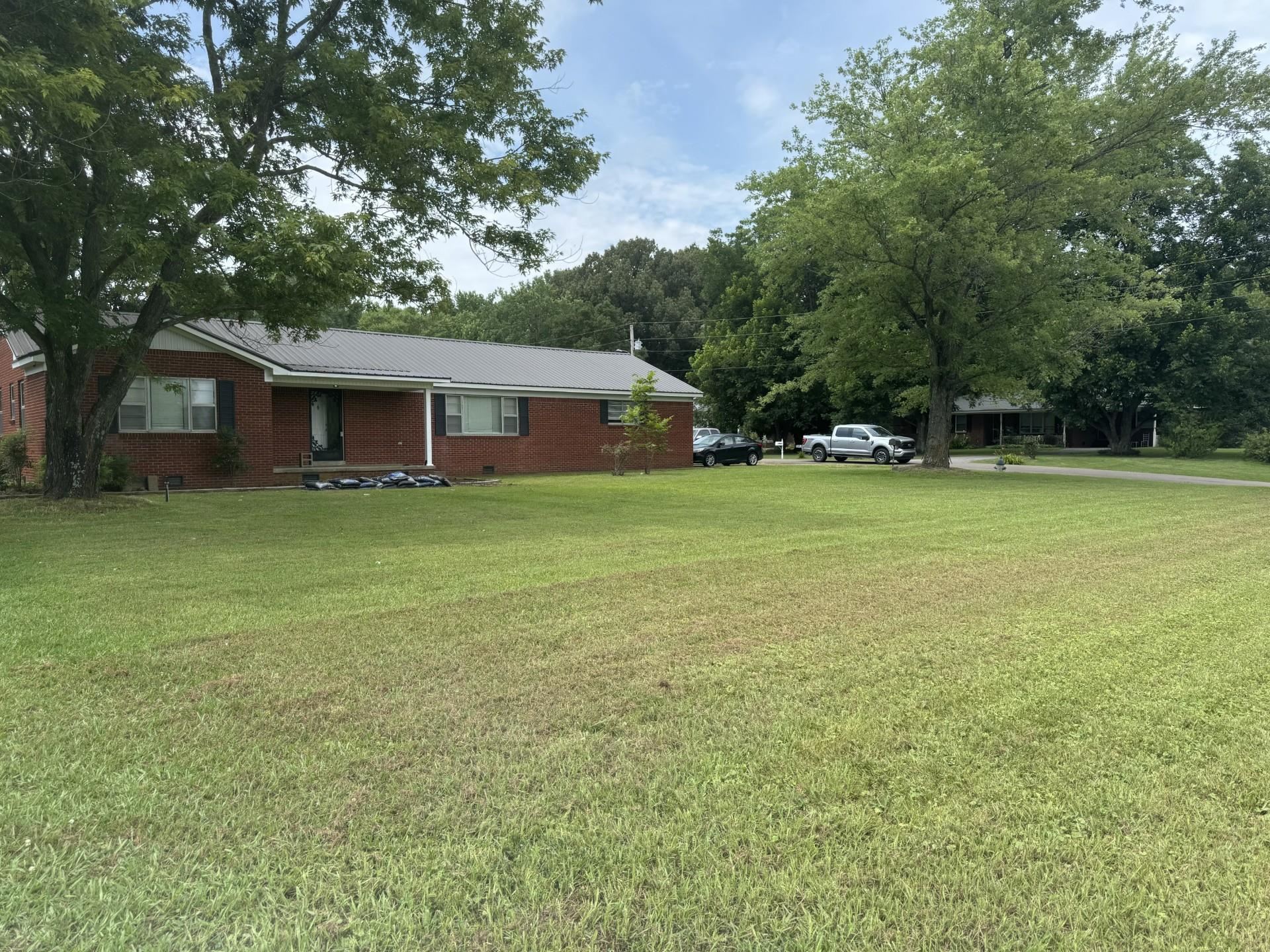 2631 Highway 51 Ripley, TN 38063 - Photo 2 of 17 a front view of house with yard and trees