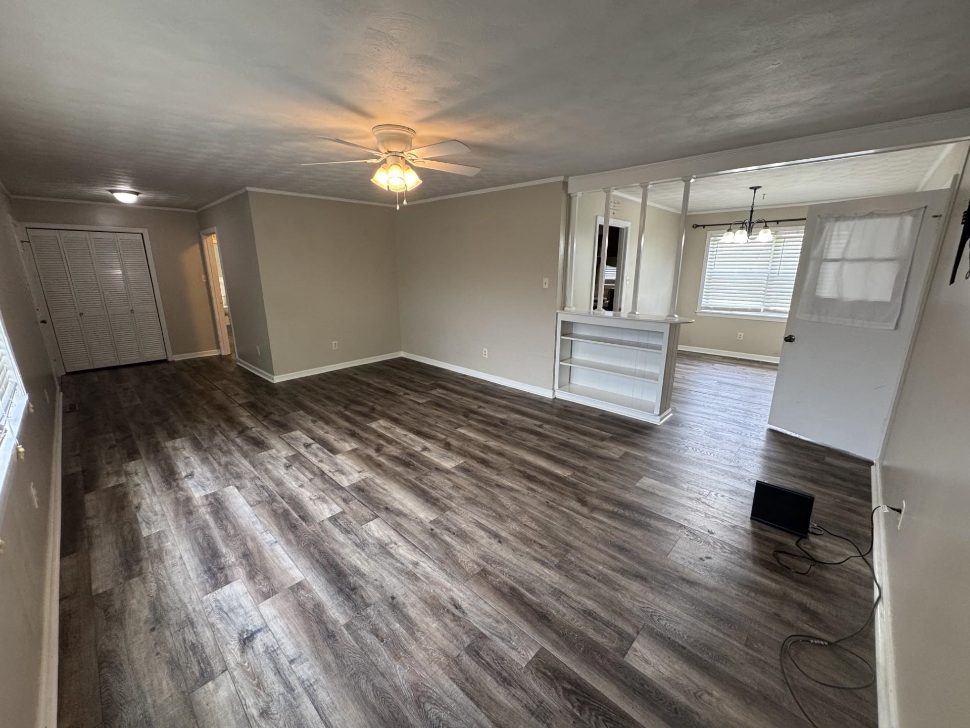2631 Highway 51 Ripley, TN 38063 - Photo 5 of 17 a view of livingroom with hardwood floor and kitchen