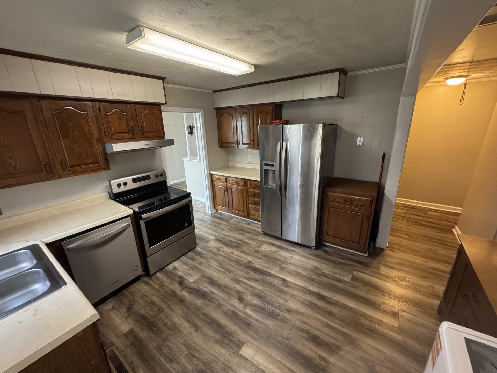 2631 Highway 51 Ripley, TN 38063 - Photo 8 of 17 a kitchen with stainless steel appliances granite countertop a refrigerator and a stove