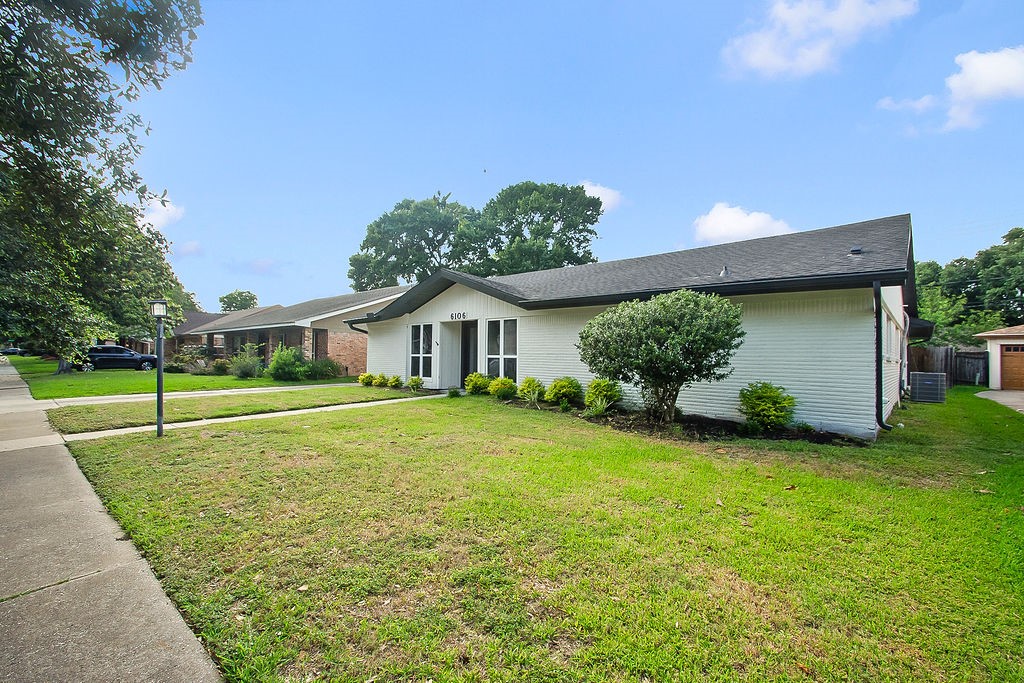 6106 Rutherglenn Drive Houston, TX 77096 - Photo 3 of 41 Another view of the beautifully updated exterior with modern design and mature landscaping.