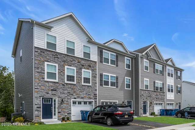 a car parked in front of a brick building