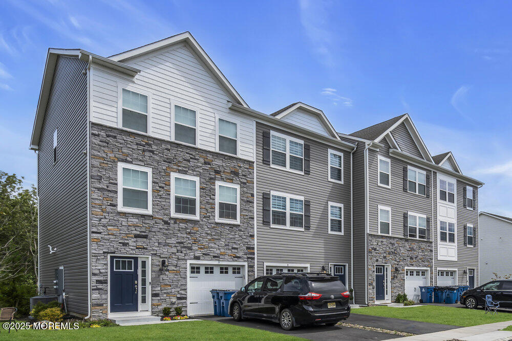 a car parked in front of a brick building