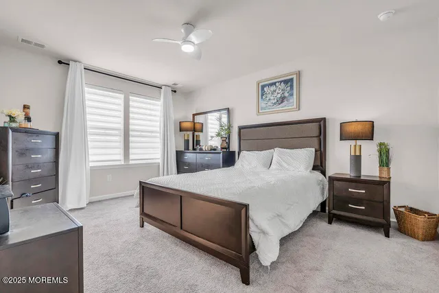 a bed room with a bed and a night stand