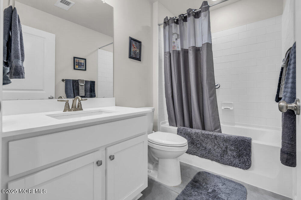 8 Avalon Lane Jackson, NJ 08527 - Photo 18 of 30 a bathroom with a sink toilet a mirror and shower