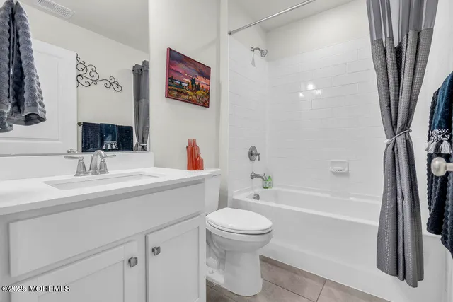 a bathroom with a sink a toilet and a bathtub