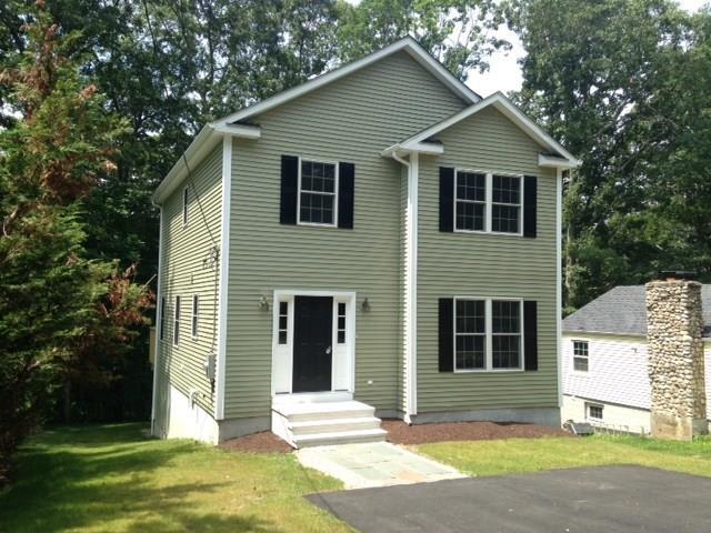 82 Bayview Road East Lyme, CT 06357 - Photo 1 of 1 a view of a house with a yard and garage