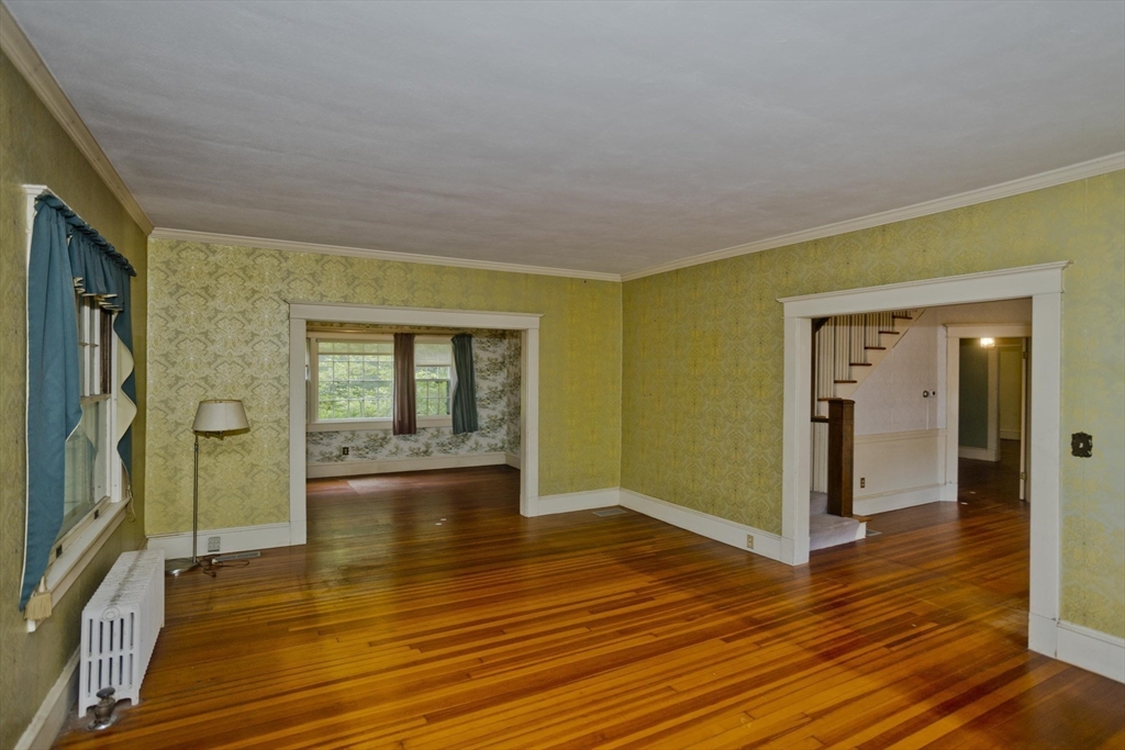 83 Mountain Road Wilbraham, MA 01095 - Photo 11 of 42 a view of empty room with wooden floor and fan