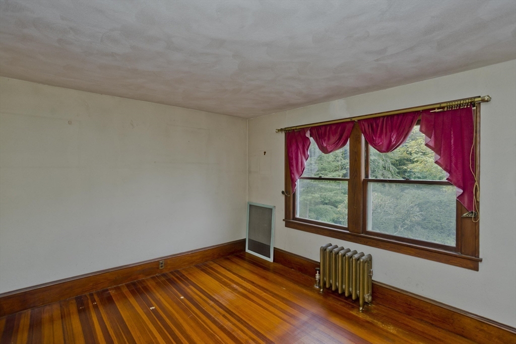 83 Mountain Road Wilbraham, MA 01095 - Photo 23 of 42 a view of empty room with wooden floor and fan