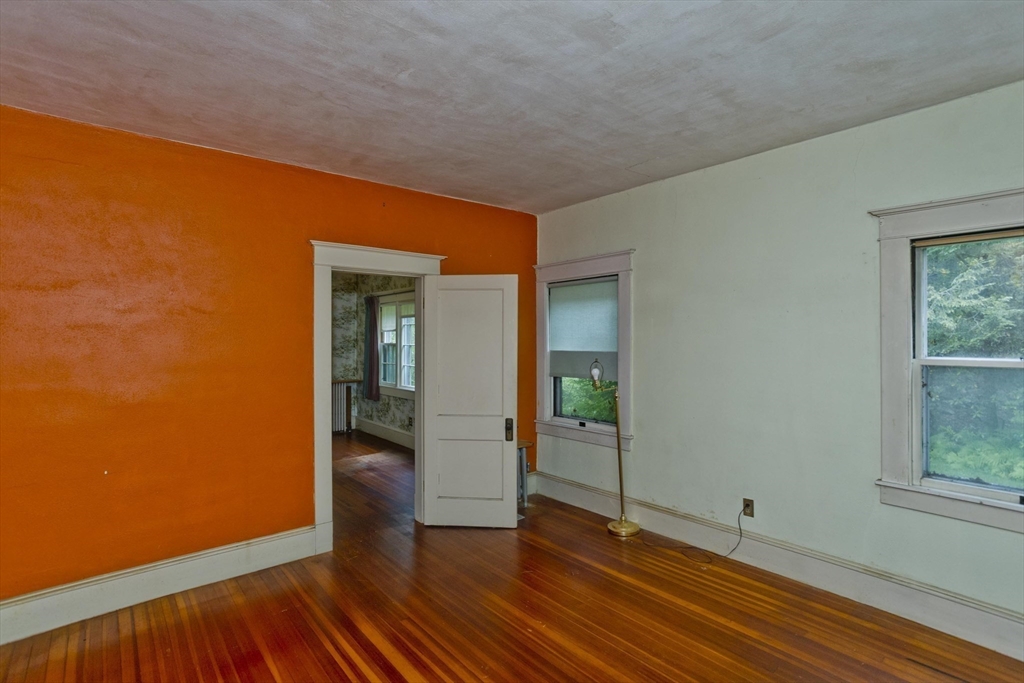83 Mountain Road Wilbraham, MA 01095 - Photo 26 of 42 an empty room with wooden floor and windows