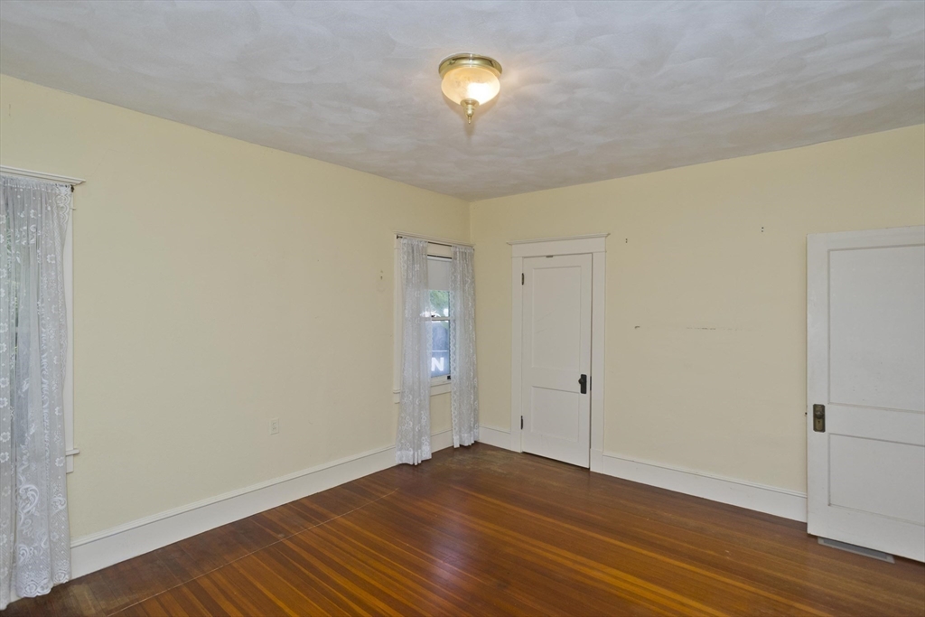 83 Mountain Road Wilbraham, MA 01095 - Photo 28 of 42 a view of an empty room with wooden floor