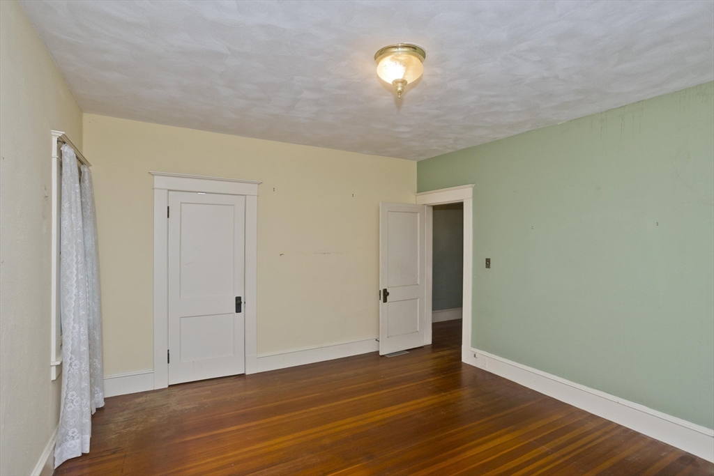 83 Mountain Road Wilbraham, MA 01095 - Photo 29 of 42 a view of an empty room with wooden floor and a window