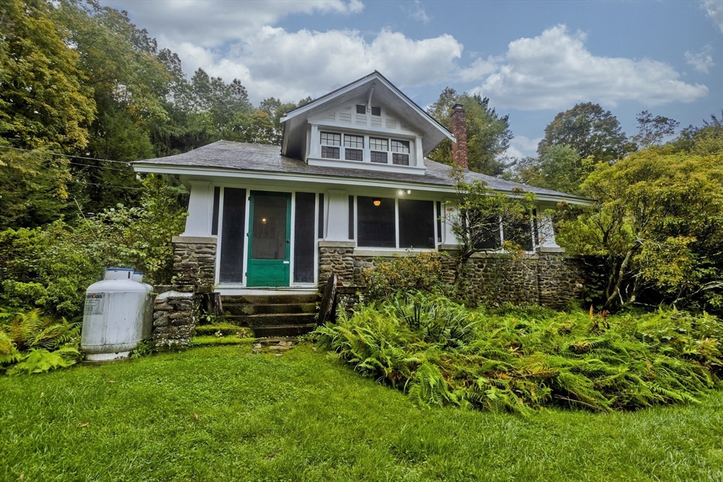 83 Mountain Road Wilbraham, MA 01095 - Photo 3 of 42 a front view of a house with garden