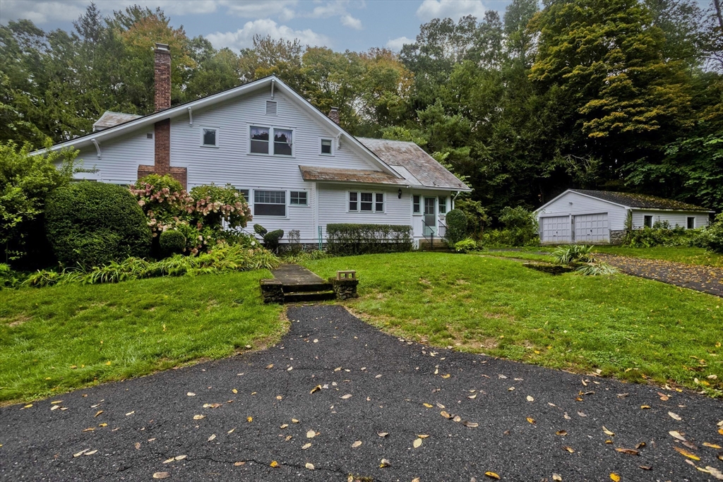 83 Mountain Road Wilbraham, MA 01095 - Photo 34 of 42 a front view of a house with garden