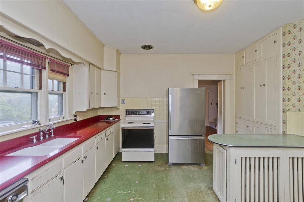 83 Mountain Road Wilbraham, MA 01095 - Photo 4 of 42 a kitchen with a refrigerator and a sink
