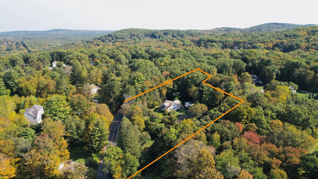 83 Mountain Road Wilbraham, MA 01095 - Photo 42 of 42 a view of a house with a mountain and a forest