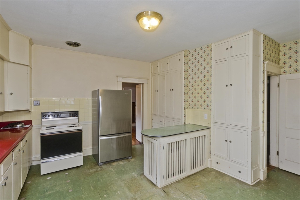 83 Mountain Road Wilbraham, MA 01095 - Photo 5 of 42 a kitchen with cabinets and stainless steel appliances