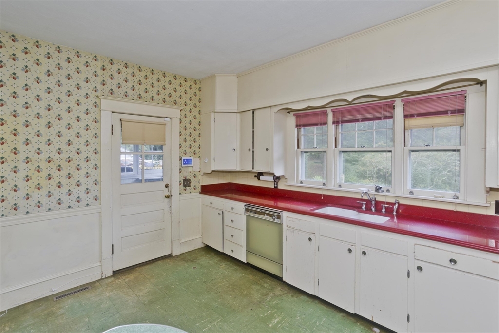 83 Mountain Road Wilbraham, MA 01095 - Photo 7 of 42 a kitchen with a sink and a window