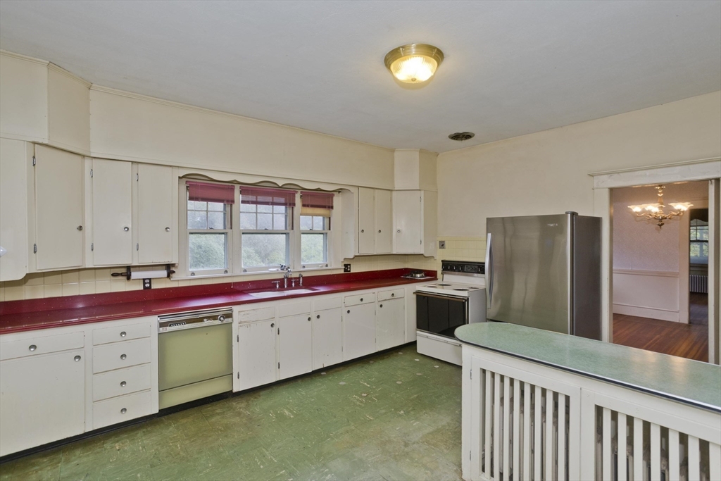 83 Mountain Road Wilbraham, MA 01095 - Photo 8 of 42 a kitchen with a sink cabinets and window
