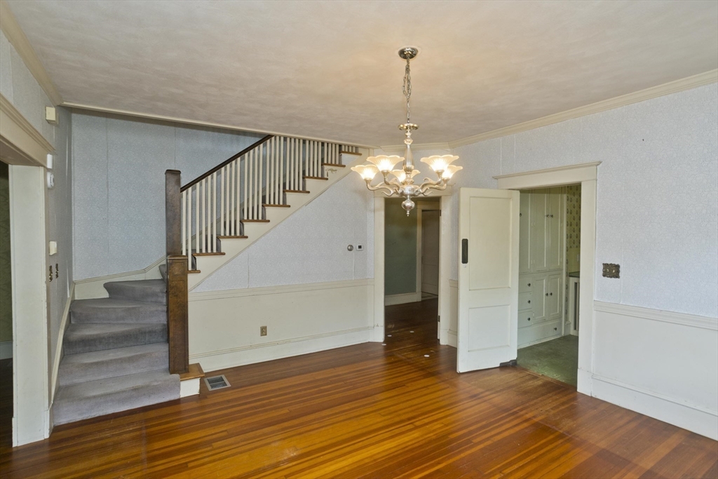 83 Mountain Road Wilbraham, MA 01095 - Photo 10 of 42 a view of a hallway with wooden floor and staircase