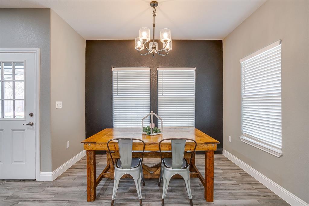 409 Titus Drive Springtown, TX 76082 - Photo 17 of 39 a view of a dining room with furniture and window
