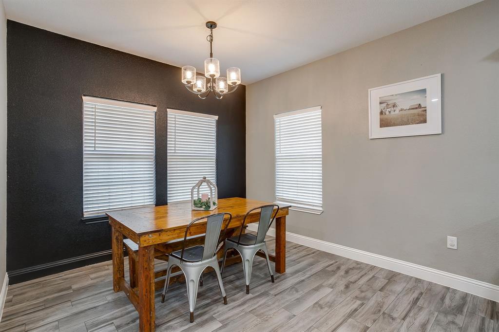 409 Titus Drive Springtown, TX 76082 - Photo 18 of 39 a view of a dining room with furniture window and wooden floor