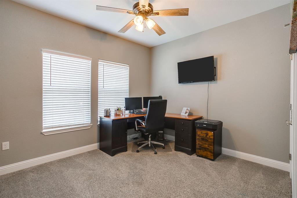 409 Titus Drive Springtown, TX 76082 - Photo 28 of 39 a view of a workspace with furniture and a window