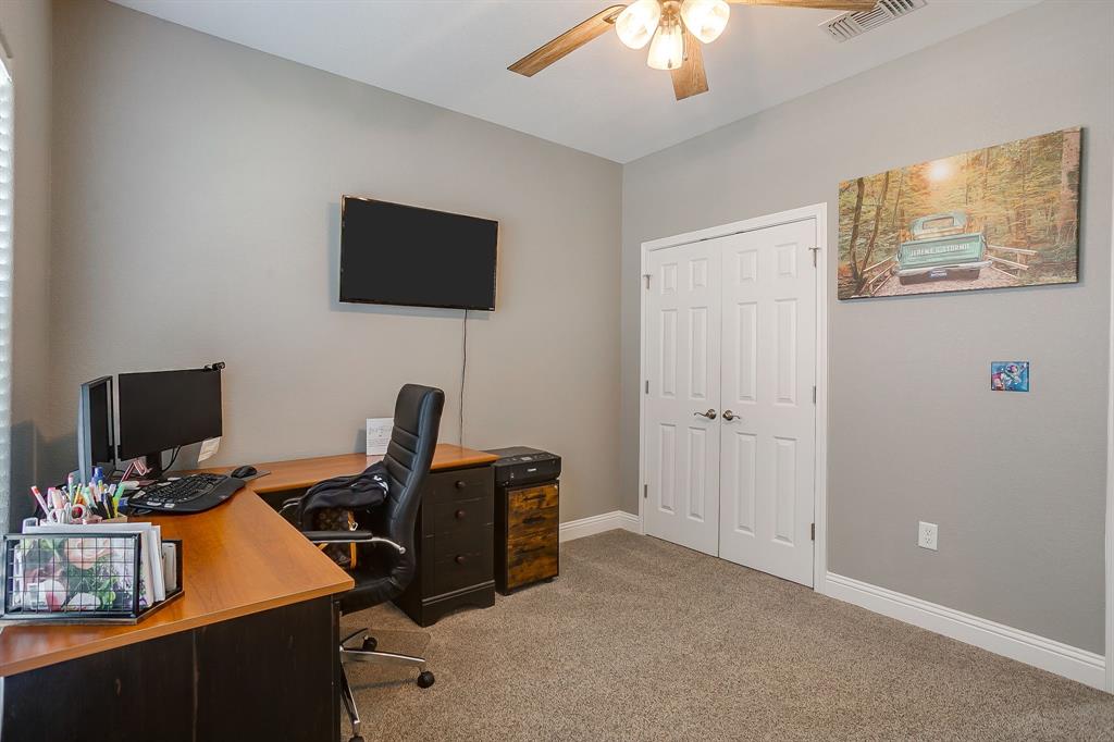 409 Titus Drive Springtown, TX 76082 - Photo 29 of 39 a view of a workspace with furniture and a window