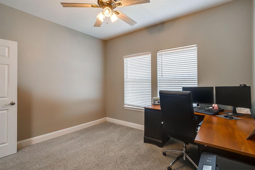 409 Titus Drive Springtown, TX 76082 - Photo 30 of 39 a view of a workspace with furniture and a window