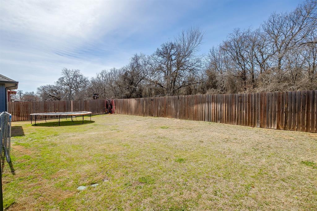 409 Titus Drive Springtown, TX 76082 - Photo 35 of 39 a swimming pool with wooden fence